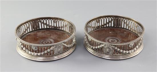 A pair of George III silver wine coasters, by J.E. Terrey & Co, 12.4cm.